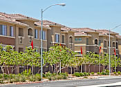Thumbnail 26 of 27 - a row of houses with red flags in front of them