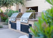 Thumbnail 11 of 15 - Outdoor BBQs for Resident at Finisterra Luxury Apartments for Rent