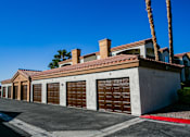 Thumbnail 17 of 18 - a row of garage doors in front of a house