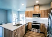 Thumbnail 8 of 19 - New Apartments Ridgefield WA with Stainless Steel Appliances in Kitchen