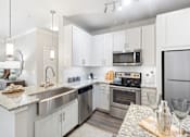 Thumbnail 12 of 20 - Upgraded Modern Kitchen with Granite Countertops in Glendale Apartment