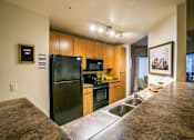 Thumbnail 7 of 15 - Full Kitchen with Efficient Appliances at Tucson Apartments for Rent