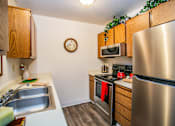Thumbnail 13 of 30 - Full Kitchen with Stainless Steel Appliances at Apartments 89029