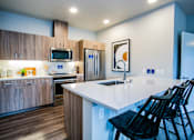 Thumbnail 5 of 19 - Spacious Kitchen with Bar at Rentals Camas Washington