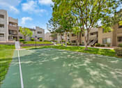 Thumbnail 16 of 20 - Shady Outdoor Basketball Court at Best Apartments ABQ La Mirage