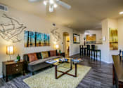 Thumbnail 13 of 27 - a living room with a couch and a table