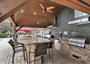 Thumbnail 20 of 28 - Outdoor Kitchen and BBQ Area at Apartments on Satellite Blvd