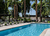 Thumbnail 6 of 20 - Refreshing Swimming Pool with Lounge at Apartments near SR 101
