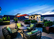 Thumbnail 21 of 23 - Rooftop Patio with Seating and Outdoor BBQs