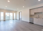 Thumbnail 18 of 20 - Living Area with Custom Cabinets, Wood Vinyl Floors & Sliding Glass Doors to Private Balcony