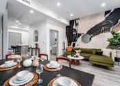 Thumbnail 14 of 26 - a dining room with a table and chairs and a living room at Lido Apartments - 4025 Grandview, Culver City, CA, 90066