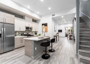 Thumbnail 4 of 26 - a kitchen with a counter top and a staircase at Lido Apartments - 4025 Grandview, California, 90066
