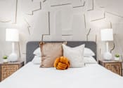 Thumbnail 20 of 26 - a bedroom with a large bed with white sheets and pillows at Lido Apartments - 4025 Grandview, California, 90066