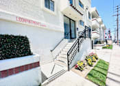Thumbnail 4 of 7 - A white building with the name LIDOAPARTMENTS.COM on the side.