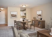 Thumbnail 5 of 26 - A dining room with a table set for four.