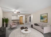 Thumbnail 1 of 23 - a living room with a couch and a coffee table