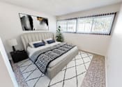 Thumbnail 17 of 19 - a bedroom with a bed and a large window