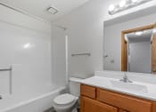 Thumbnail 5 of 21 - a bathroom with a sink toilet and a mirror