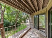 Thumbnail 13 of 21 - the screened in porch has a view of the yard and trees