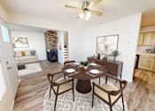 Thumbnail 18 of 19 - an open living room and dining room with a table and chairs