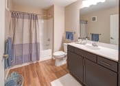 Thumbnail 3 of 11 - a bathroom with a sink toilet and a shower