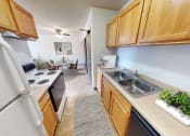 Thumbnail 2 of 19 - the view of a kitchen and dining room from the entrance of a home
