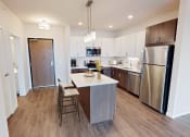 Thumbnail 21 of 44 - a kitchen with stainless steel appliances and a white counter top