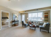 Thumbnail 6 of 25 - Living room and an open door to a bedroom