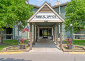 Thumbnail 19 of 19 - a rentals office with an american flag on the side of the road