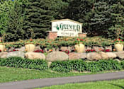 Thumbnail 32 of 32 - Outdoor property sign atop grass and large rocks that reads "Greenfield"
