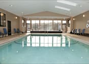 Thumbnail 16 of 32 - Indoor pool room with large windows
