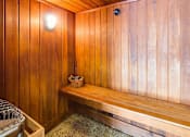 Thumbnail 20 of 32 - Wood panneled sauna with a bench