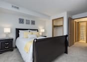 Thumbnail 4 of 26 - A bedroom with a large bed and a dresser.