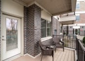 Thumbnail 11 of 25 - Outdoor patio with brown chairs