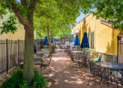 Thumbnail 41 of 44 - Outdoor restaurant seating on a sunny day