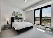 Thumbnail 3 of 44 - Bedroom with white walls, lamp shades, and comforters