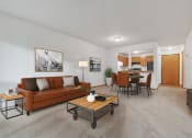 Thumbnail 1 of 21 - the living room of an apartment with a couch and a coffee table