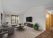 Thumbnail 13 of 14 - the living room of an apartment with a couch and a tv