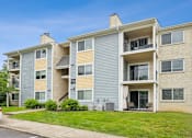 Thumbnail 6 of 25 - Apartment building with a blue sky in the background at Chinoe Creek Apartments, Kentucky