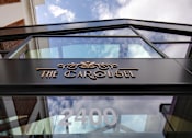 Thumbnail 43 of 43 - The Carousel building has a glass window with the number 2400 on it at The Carousel Apartments, Virginia, 23220