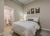 Thumbnail 48 of 51 - A bedroom with a white bed and a green headboard at The Carousel Apartments, Richmond, Virginia