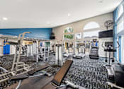 Thumbnail 10 of 25 - A gym with a variety of equipment including treadmills, weights, and exercise machines at Chinoe Creek Apartments, Kentucky, 40502