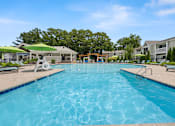 Thumbnail 2 of 31 - A large swimming pool in a sunny outdoor setting. at Linkhorn Bay Apartments, Virginia Beach, VA, 23451