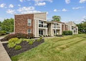 Thumbnail 4 of 32 - our apartments at the district feature a spacious yard and green grass at The Grove at Lyndon, Louisville