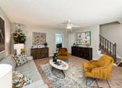 Thumbnail 15 of 19 - a living room with couches and chairs and a staircase at Hyde Park Townhomes, PRG Real Estate Management, Chester, VA