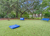 Thumbnail 4 of 22 - A park with a blue bench and a blue mattress.