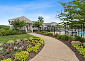Thumbnail 1 of 19 - a sidewalk in front of a house with a pool at Hyde Park Townhomes, PRG Real Estate Management, Chester, VA