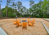 Thumbnail 5 of 19 - a fire pit with chairs around it in a park at Chapel View Apartments in Chapel Hill, NC