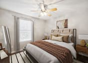 Thumbnail 28 of 29 - Bedroom with a Large Bed and a Ceiling Fan at 45 Madison Apartments, Missouri, 64111