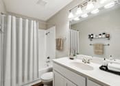 Thumbnail 20 of 37 - A modern bathroom with a white sink and a white toilet.at Chapel View, North Carolina, 27516